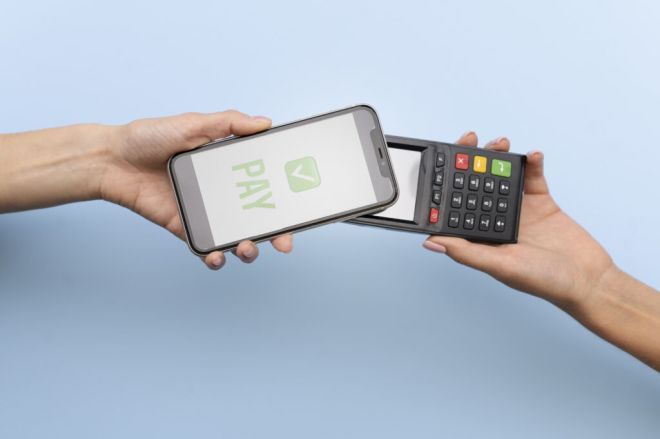 person paying with its smartphone wallet app